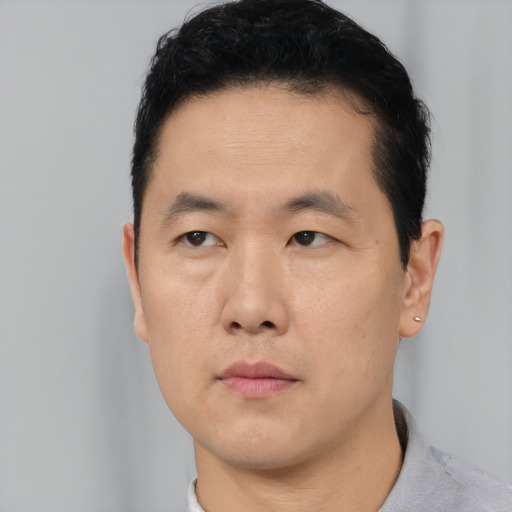 Neutral asian young-adult male with short  black hair and brown eyes