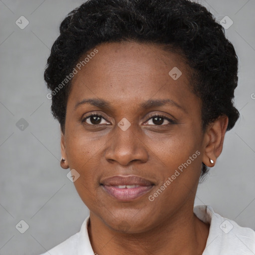 Joyful black adult female with short  brown hair and brown eyes