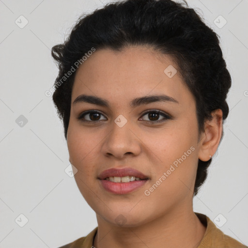 Joyful latino young-adult female with short  brown hair and brown eyes