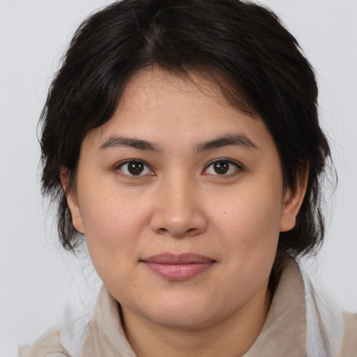 Joyful white young-adult female with medium  brown hair and brown eyes