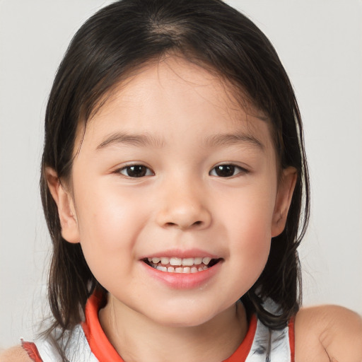 Joyful white child female with medium  brown hair and brown eyes