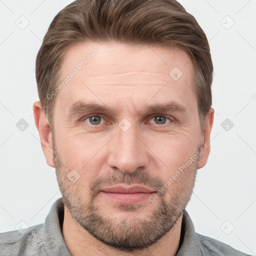 Joyful white adult male with short  brown hair and grey eyes