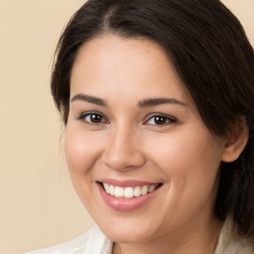 Joyful white young-adult female with medium  brown hair and brown eyes