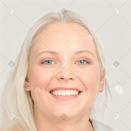 Joyful white young-adult female with long  blond hair and blue eyes