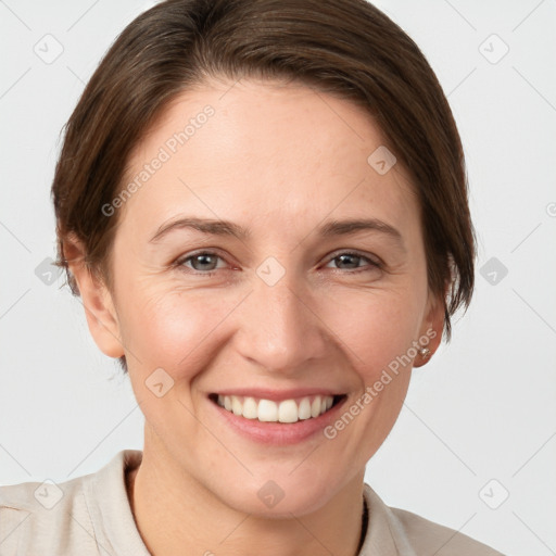 Joyful white young-adult female with short  brown hair and brown eyes