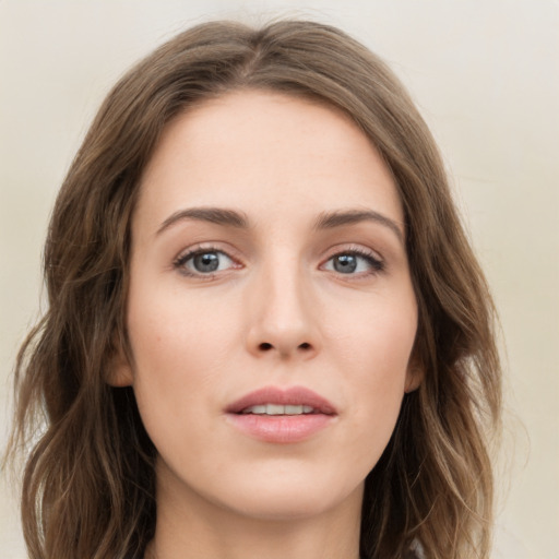 Neutral white young-adult female with long  brown hair and green eyes