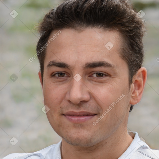 Joyful white adult male with short  brown hair and brown eyes