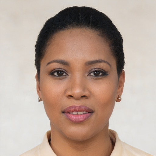 Joyful latino young-adult female with short  black hair and brown eyes