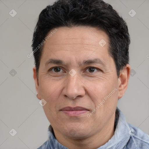 Joyful white adult male with short  black hair and brown eyes