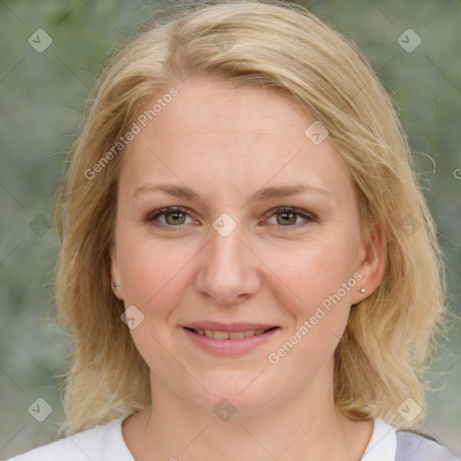 Joyful white adult female with medium  brown hair and blue eyes