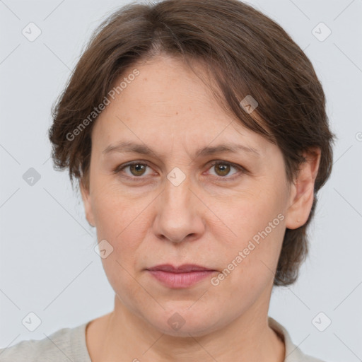 Joyful white adult female with medium  brown hair and grey eyes