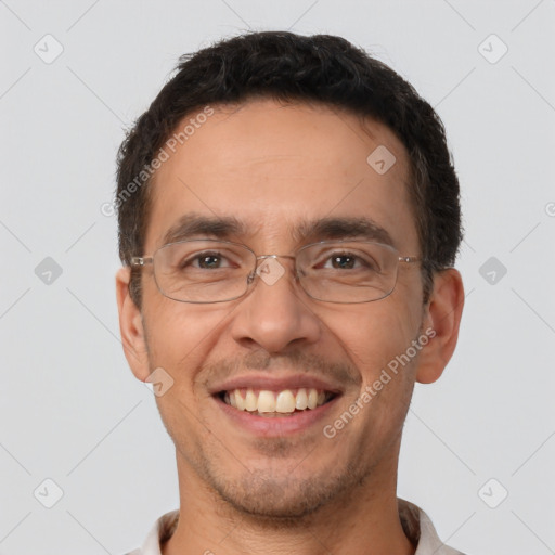 Joyful white adult male with short  brown hair and brown eyes