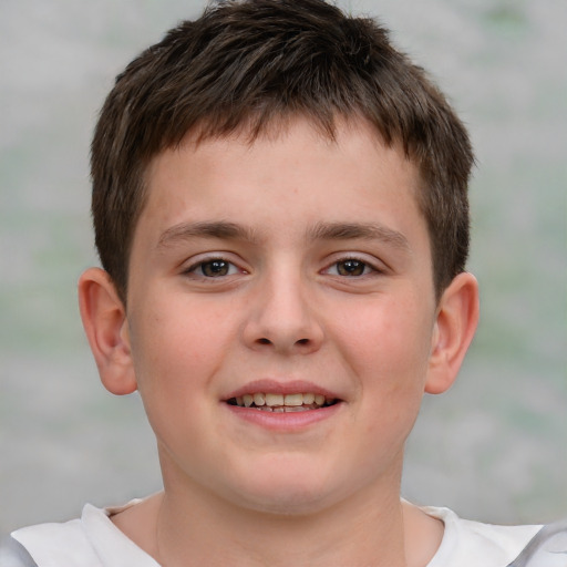 Joyful white child male with short  brown hair and brown eyes