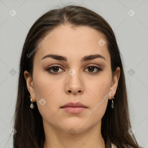 Neutral white young-adult female with long  brown hair and brown eyes