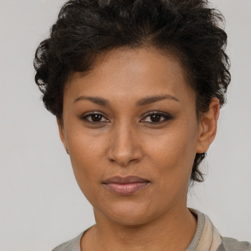 Neutral black young-adult female with short  brown hair and brown eyes
