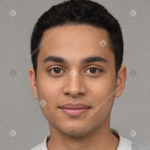 Joyful latino young-adult male with short  black hair and brown eyes