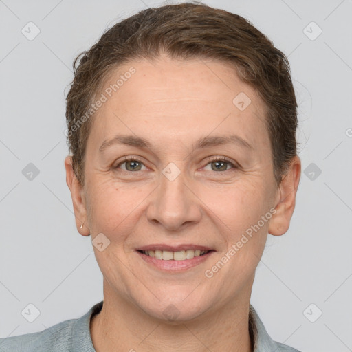 Joyful white adult female with short  brown hair and brown eyes