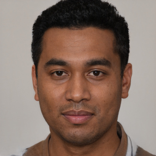 Neutral black young-adult male with short  black hair and brown eyes