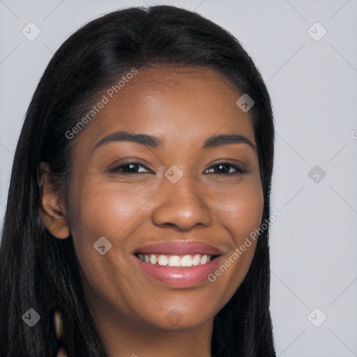 Joyful black young-adult female with long  brown hair and brown eyes