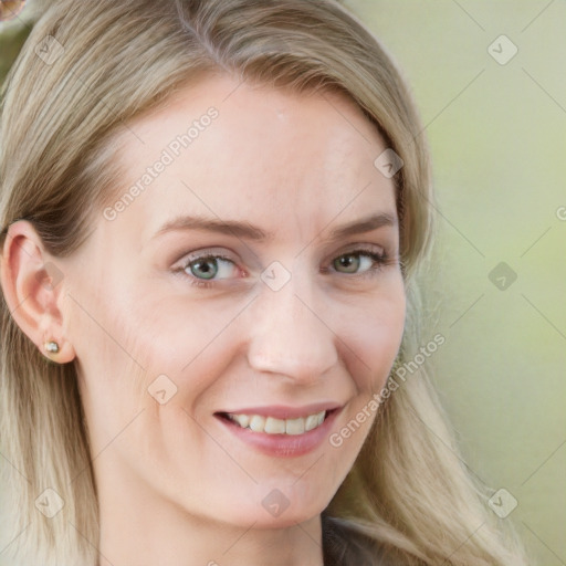 Joyful white young-adult female with long  brown hair and blue eyes