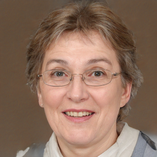 Joyful white middle-aged female with medium  brown hair and blue eyes