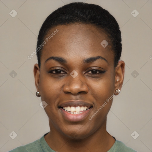 Joyful black young-adult female with short  black hair and brown eyes