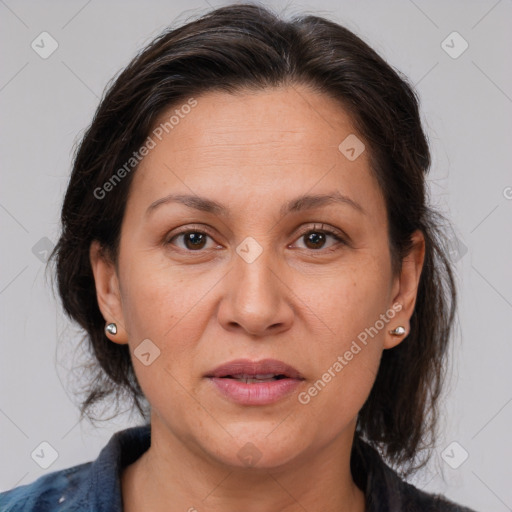 Joyful white adult female with medium  brown hair and brown eyes