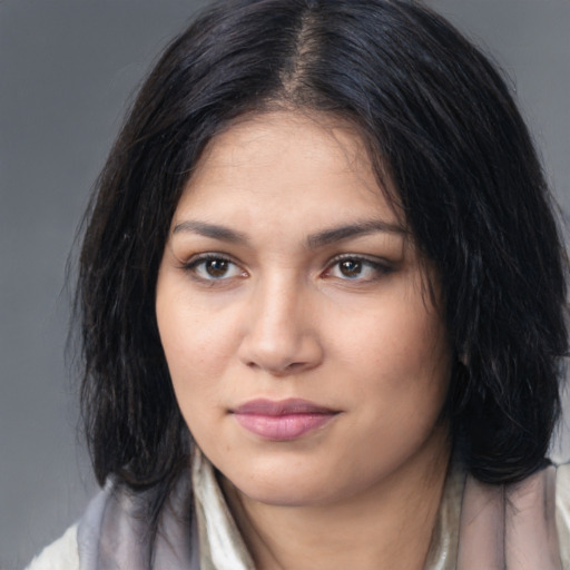 Joyful white young-adult female with medium  black hair and brown eyes