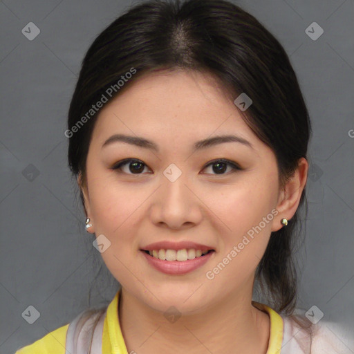 Joyful asian young-adult female with medium  brown hair and brown eyes