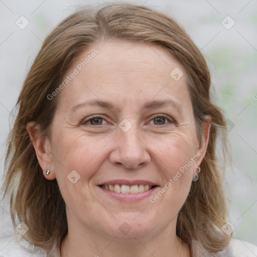 Joyful white adult female with medium  brown hair and grey eyes