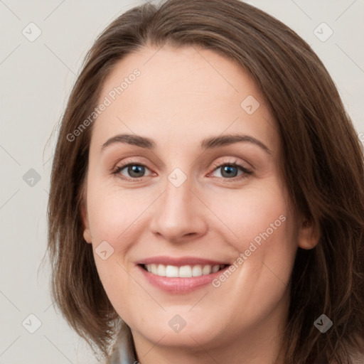 Joyful white young-adult female with long  brown hair and grey eyes