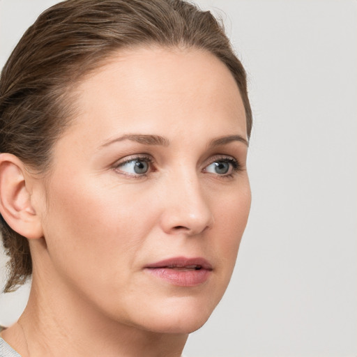 Neutral white young-adult female with medium  brown hair and blue eyes