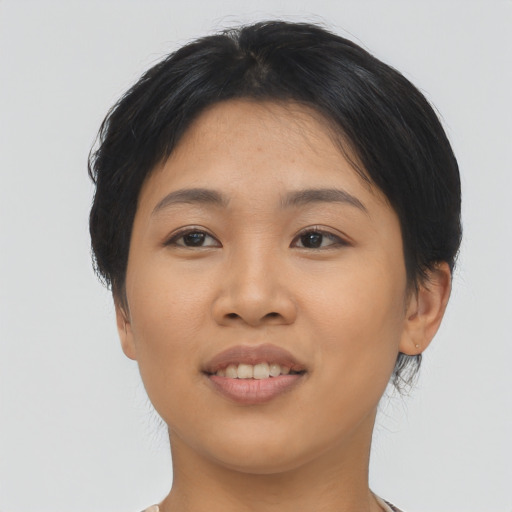 Joyful asian young-adult female with medium  black hair and brown eyes