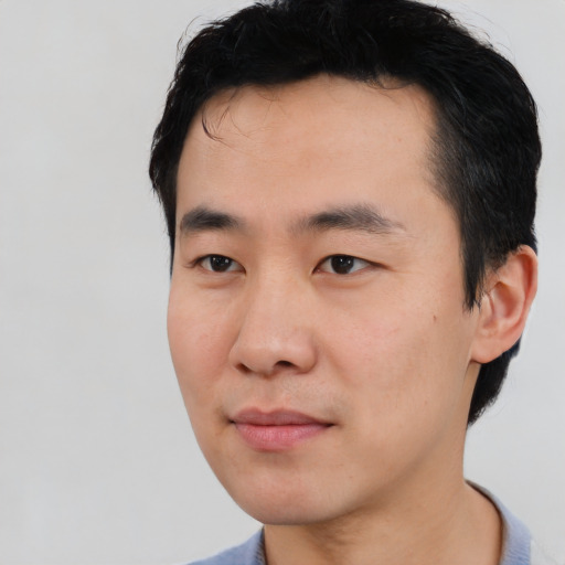 Neutral asian young-adult male with short  black hair and brown eyes