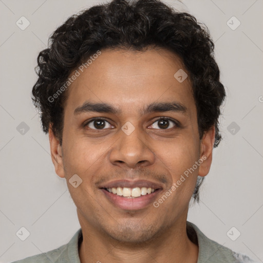 Joyful latino young-adult male with short  brown hair and brown eyes