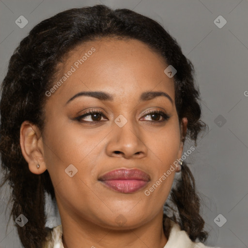 Joyful black adult female with medium  brown hair and brown eyes