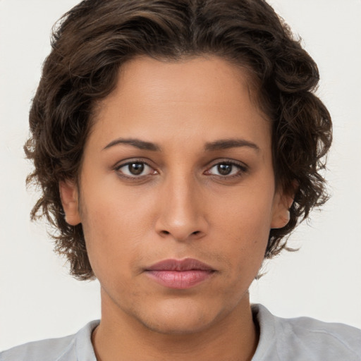 Neutral white young-adult female with short  brown hair and brown eyes