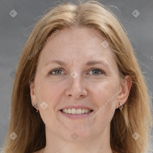 Joyful white adult female with medium  brown hair and brown eyes