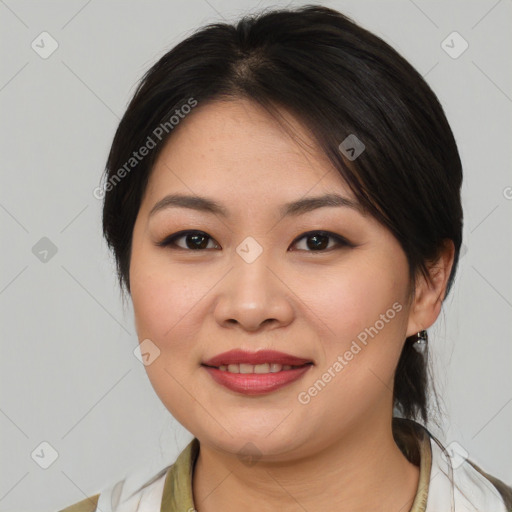 Joyful asian young-adult female with medium  brown hair and brown eyes