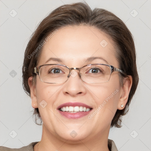 Joyful white adult female with medium  brown hair and grey eyes