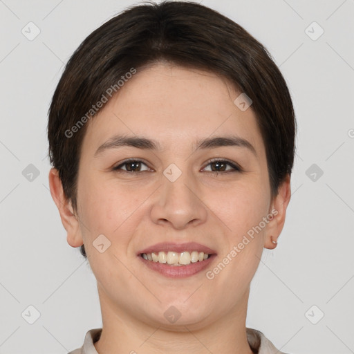 Joyful white young-adult female with short  brown hair and brown eyes