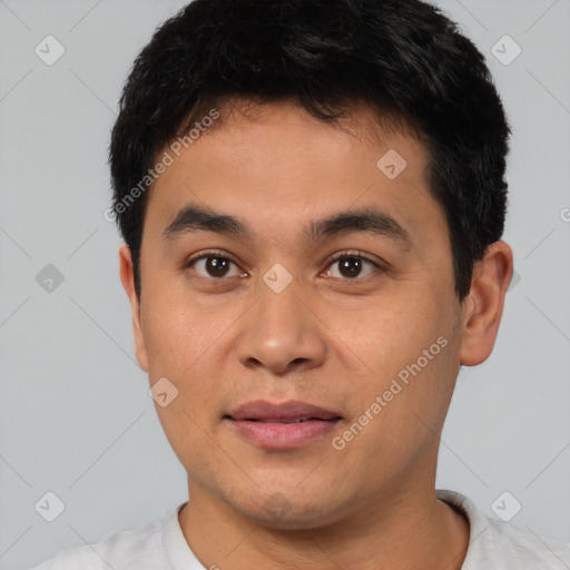 Joyful asian young-adult male with short  black hair and brown eyes