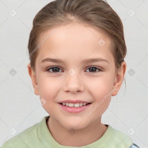 Joyful white child female with short  brown hair and brown eyes