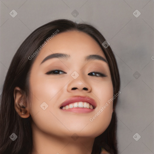 Joyful asian young-adult female with long  brown hair and brown eyes