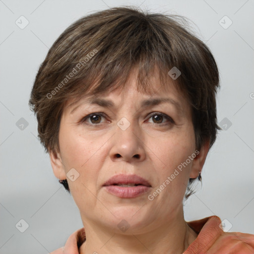 Joyful white adult female with short  brown hair and brown eyes