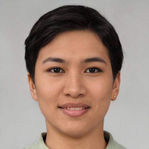 Joyful asian young-adult female with short  black hair and brown eyes