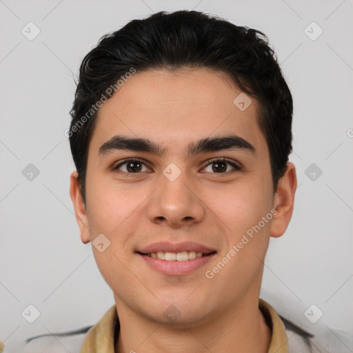 Joyful latino young-adult male with short  brown hair and brown eyes