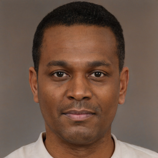 Neutral black young-adult male with short  black hair and brown eyes