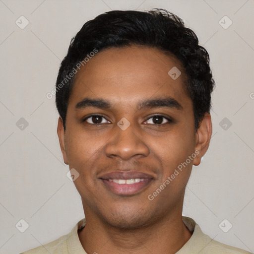 Joyful black young-adult male with short  black hair and brown eyes