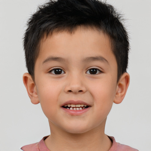 Joyful white child male with short  brown hair and brown eyes